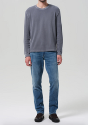 person wearing citizens of humanity mens Gage Slim Straight Cashmere Denim jeans in Anders wash