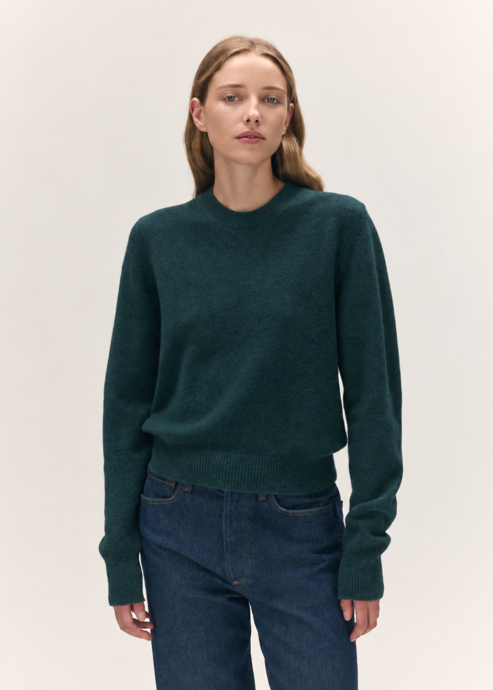 person wearing &Daughter womens Sligo Crewneck geelong lambswool sweater in Holly Green