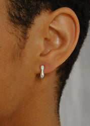 person wearing dunton ellerkamp Diamond Owen Earrings in Silver