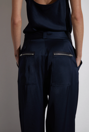 Person wearing Saint Art Courtney Charmeuse Pant in Navy
