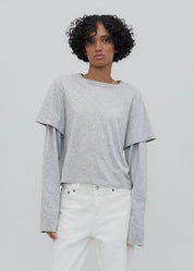person wearing Still Here New York womens 2Tee long sleeve shirt in Heather Grey