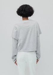 person wearing Still Here New York womens 2Tee long sleeve shirt in Heather Grey