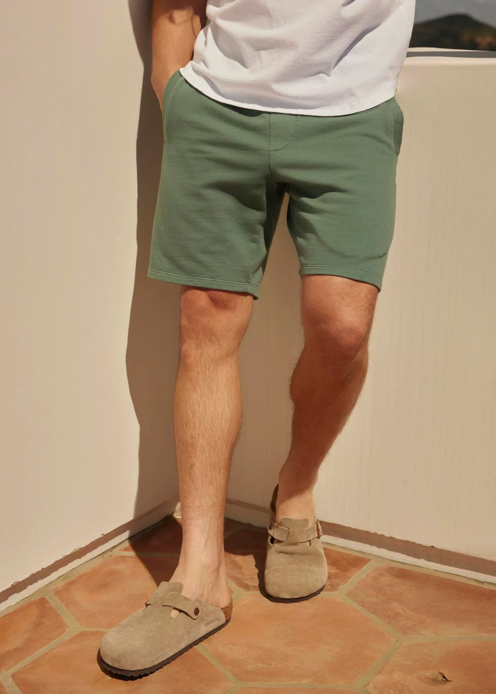 Person wearing Velvet Men's Beckett Sweatshorts in Shrub