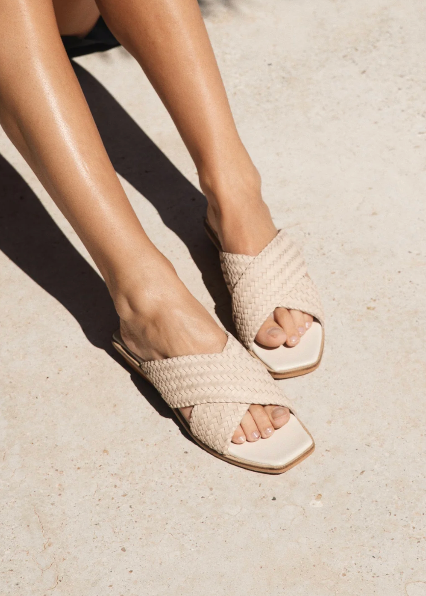person wearing bembien womens Tosca Slide in Cream woven leather sandals