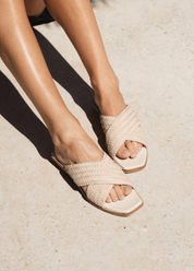 person wearing bembien womens Tosca Slide in Cream woven leather sandals