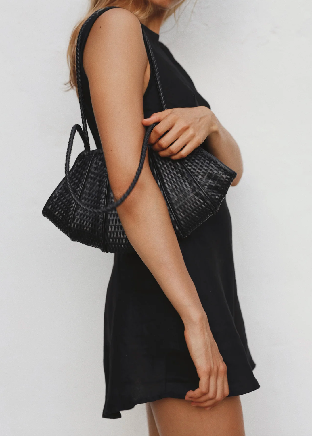 person wearing bembien womens Venera Bag in Black woven leather
