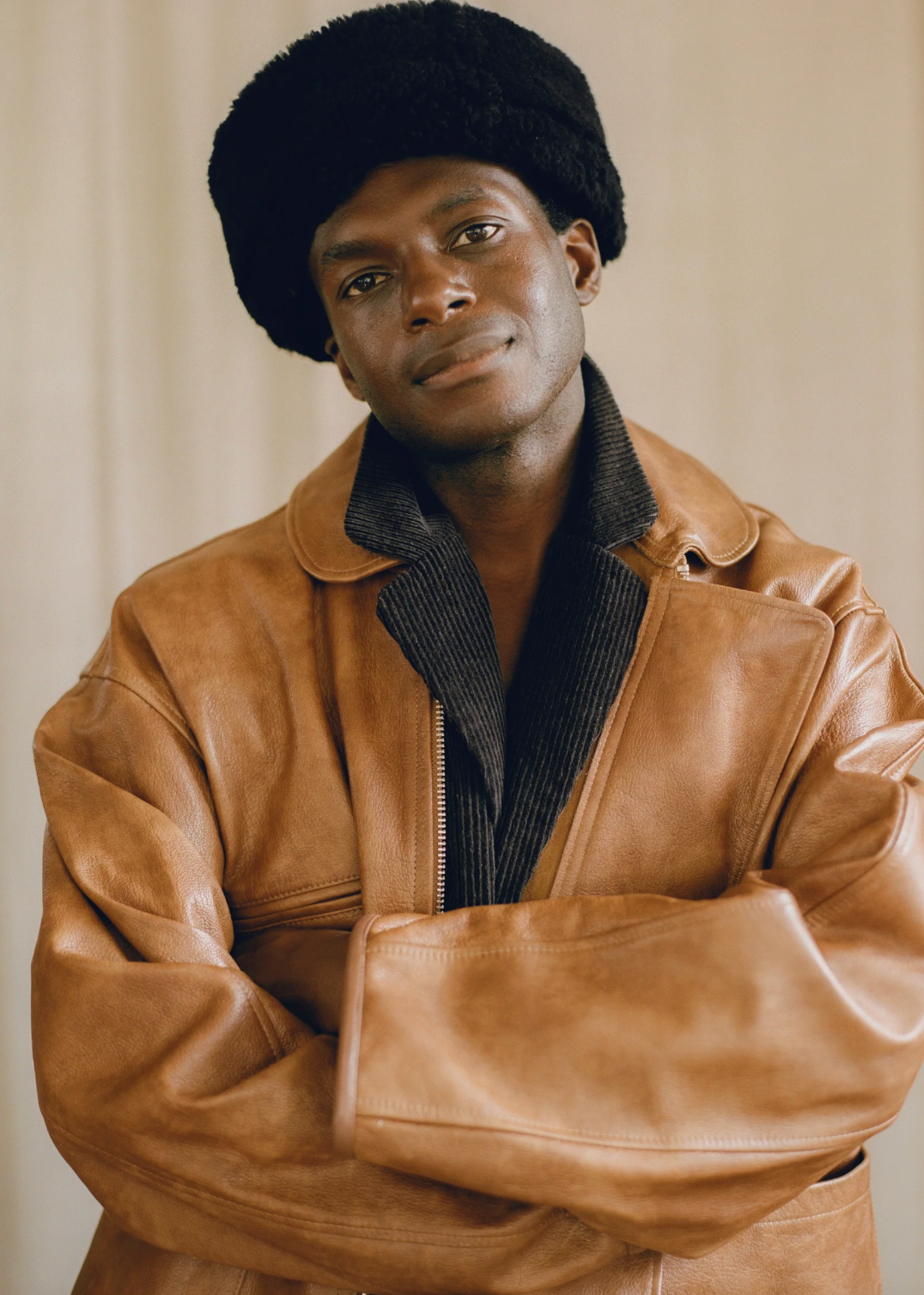 person wearing cawley studio Suede Back Curly Hair shearling Cap in Black