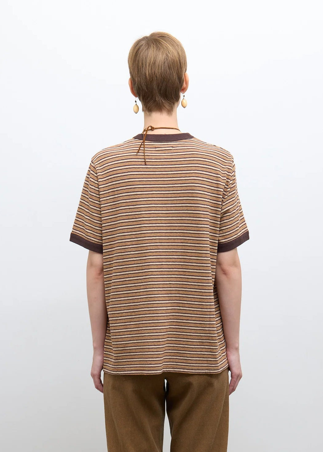 person wearing cawley studio Unisex Japanese Jersey Short Sleeve T-Shirt in Brown Stripe