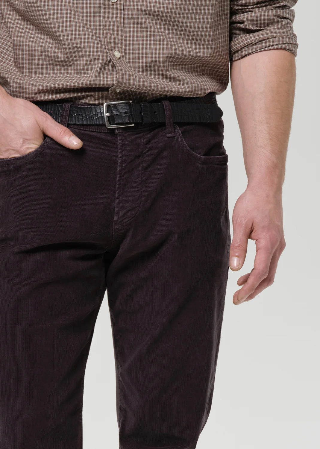 person wearing citizens of humanity mens Elijah Straight Corduroy pants in Charcoal