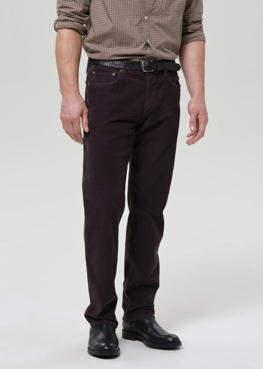 person wearing citizens of humanity mens Elijah Straight Corduroy pants in Charcoal