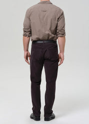 person wearing citizens of humanity mens Elijah Straight Corduroy pants in Charcoal