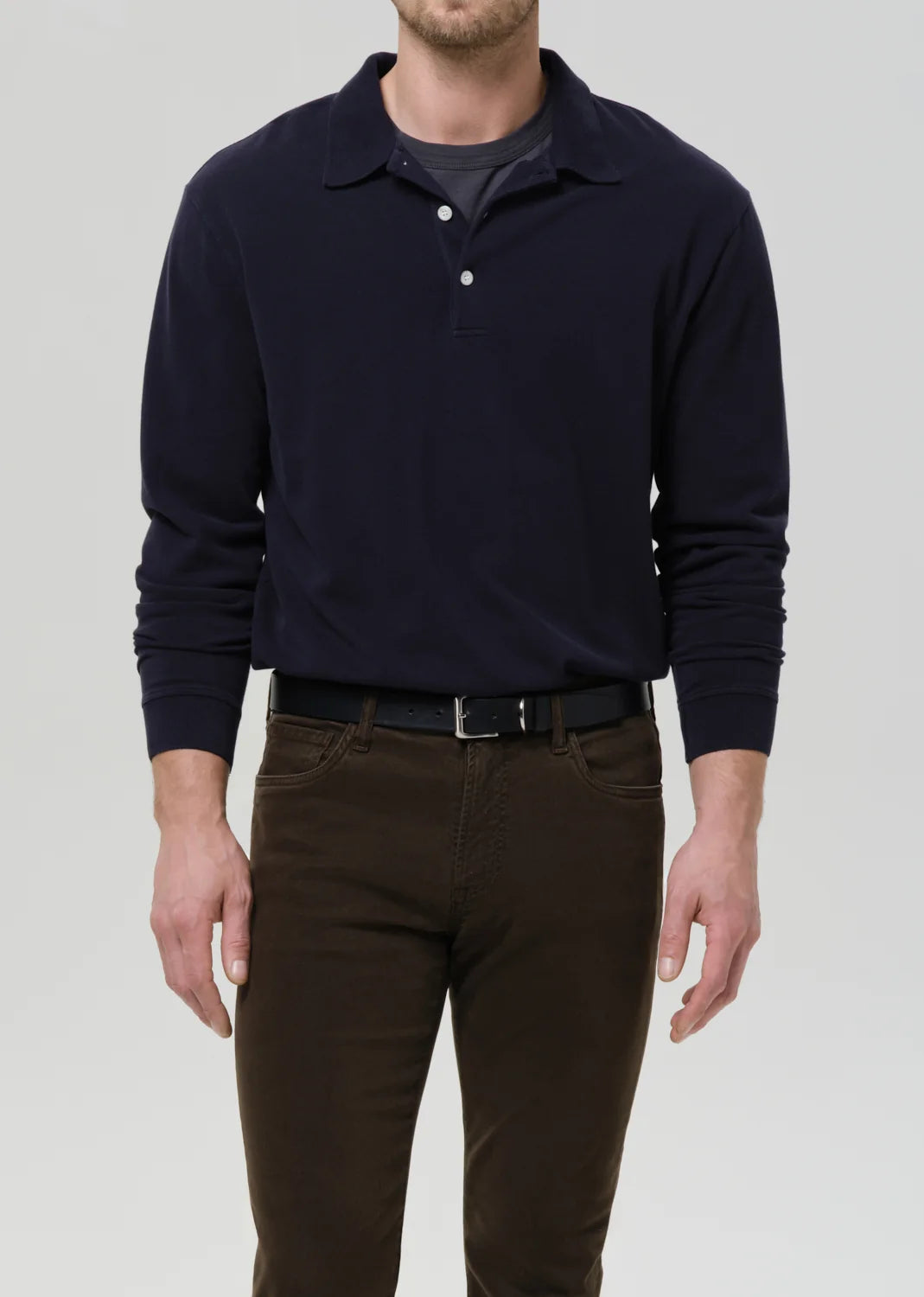 person wearing citizens of humanity mens Long Sleeve Banded Polo In Navy cotton pique