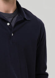 person wearing citizens of humanity mens Long Sleeve Banded Polo In Navy cotton pique