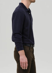person wearing citizens of humanity mens Long Sleeve Banded Polo In Navy cotton pique