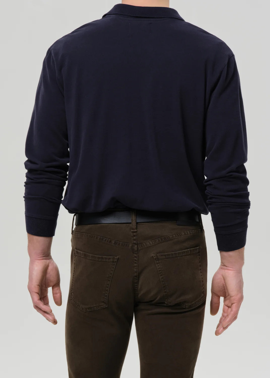 person wearing citizens of humanity mens Long Sleeve Banded Polo In Navy cotton pique