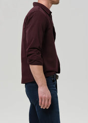 person wearing citizens of humanity mens Long Sleeve Cairo Shirt In Burgundy cotton flax linen