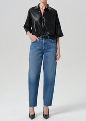 person wearing citizens of humanity womens Taper Jeans In Pastis wash indigo