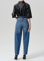 person wearing citizens of humanity womens Taper Jeans In Pastis wash indigo