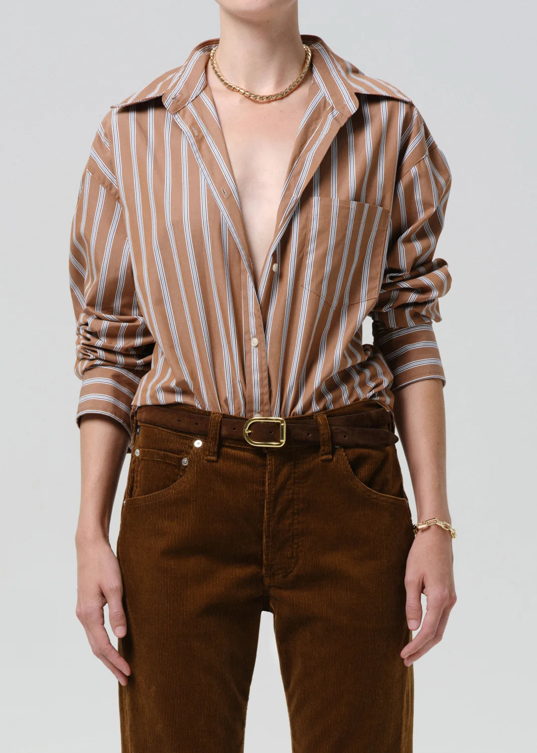 person wearing citizens of humanity womens japanese cotton Thea Boyfriend Shirt In Copper Stripe