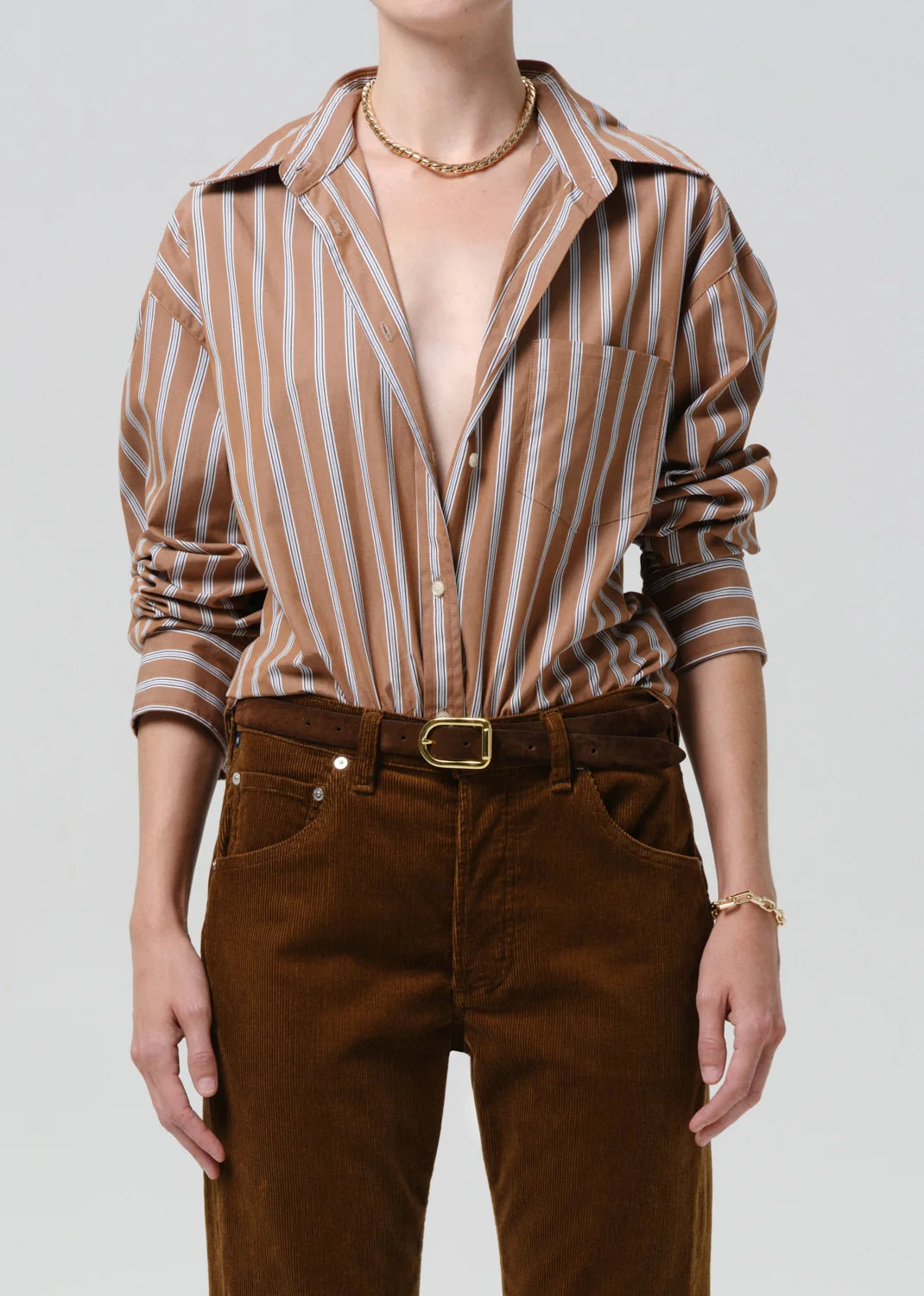 person wearing citizens of humanity womens japanese cotton Thea Boyfriend Shirt In Copper Stripe