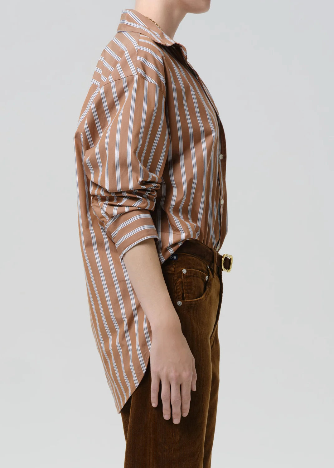 person wearing citizens of humanity womens japanese cotton Thea Boyfriend Shirt In Copper Stripe