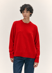 person wearing &daughter womens geelong lambswool Innes Slouch Crewneck sweater in Poppy Red