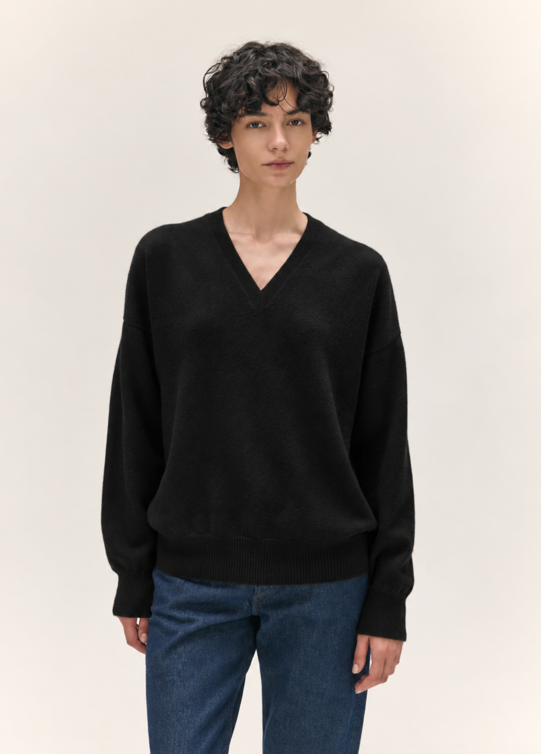 person wearing &daughter womens geelong lambswool Innes Slouch V-Neck in Black