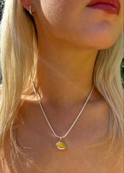 person wearing dunton ellerkamp jewelry One-of-a-Kind Snail Shell Pendant Necklace in Silver