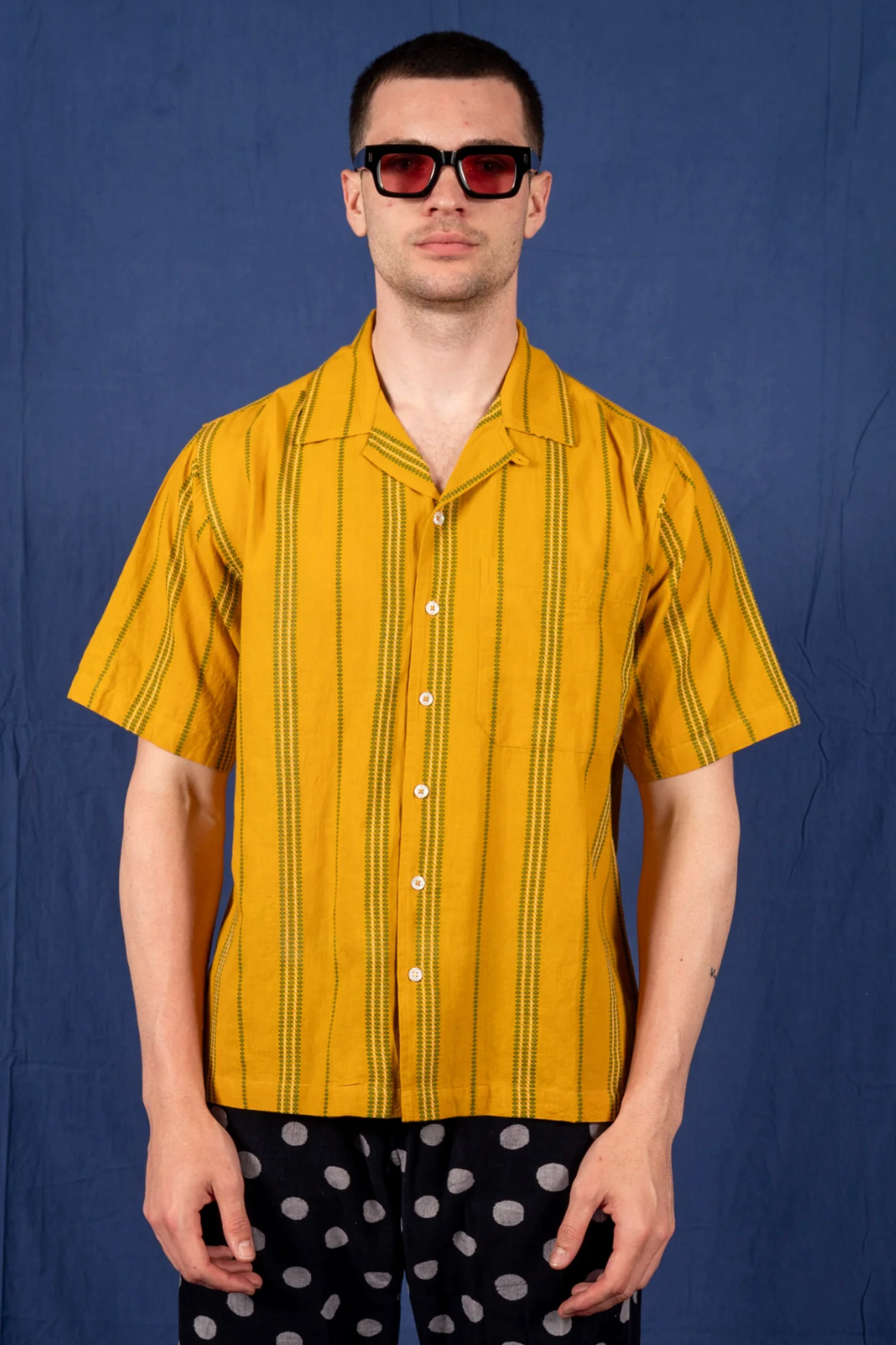 person wearing dushyant mens 'The Don' Short Sleeve Camp Shirt in Mustard with Green Jamdani Embroidery