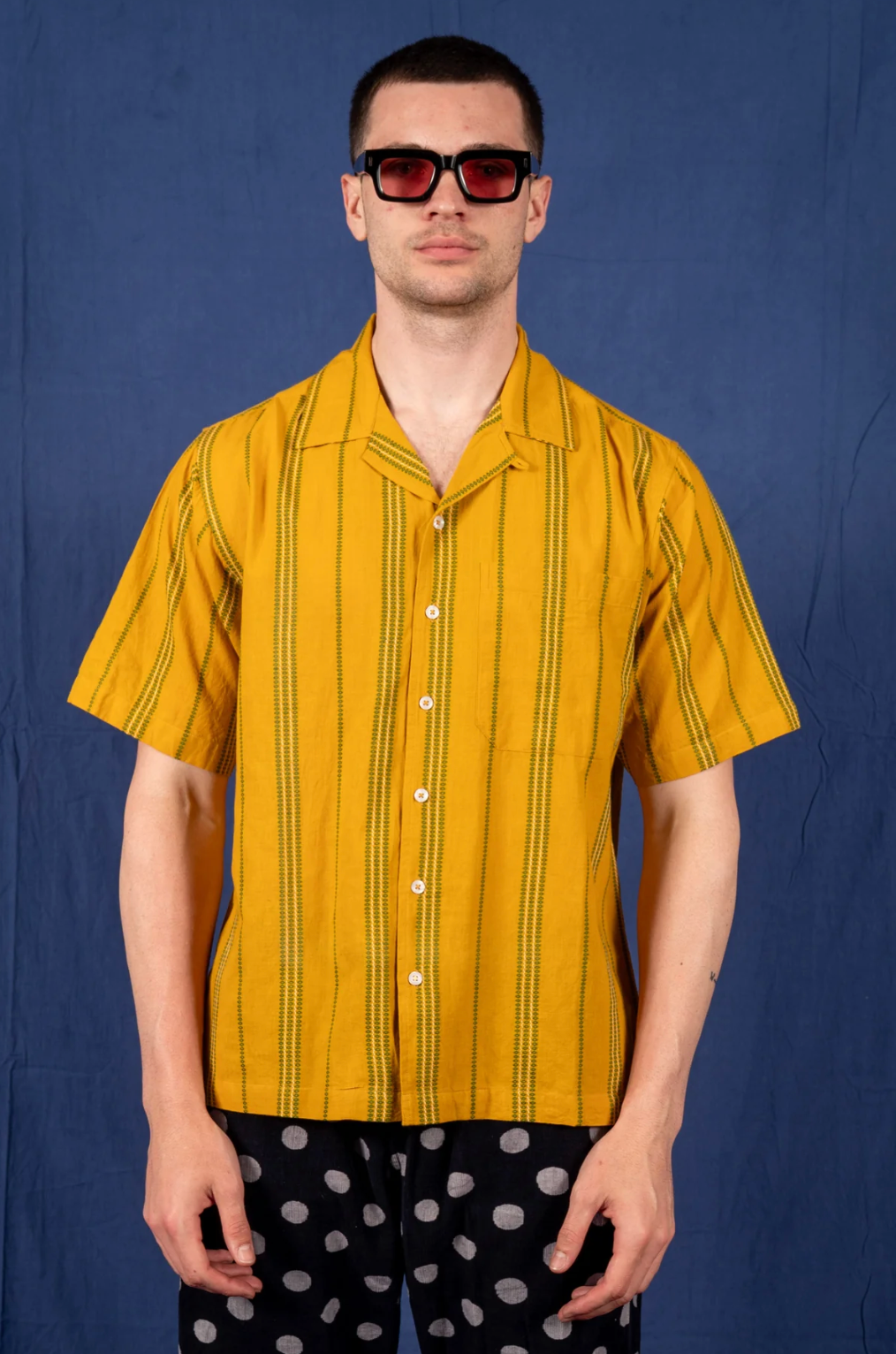 person wearing dushyant mens 'The Don' Short Sleeve Camp Shirt in Mustard with Green Jamdani Embroidery