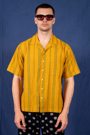 person wearing dushyant mens 'The Don' Short Sleeve Camp Shirt in Mustard with Green Jamdani Embroidery