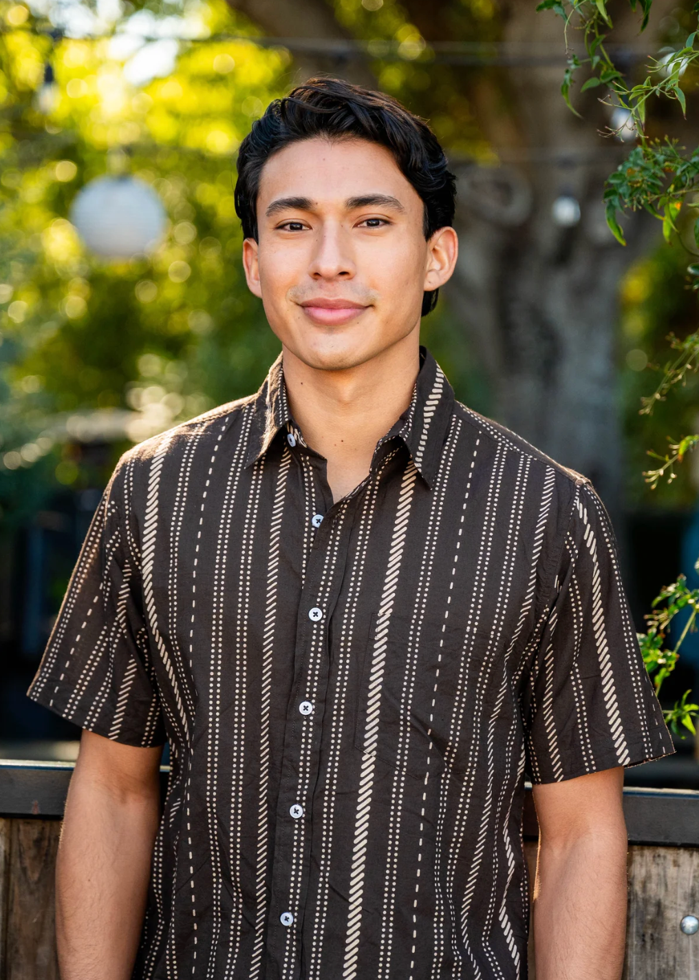 person wearing dushyant mens 'The Folk' Short Sleeve Pocket Shirt in Chocolate Stripes