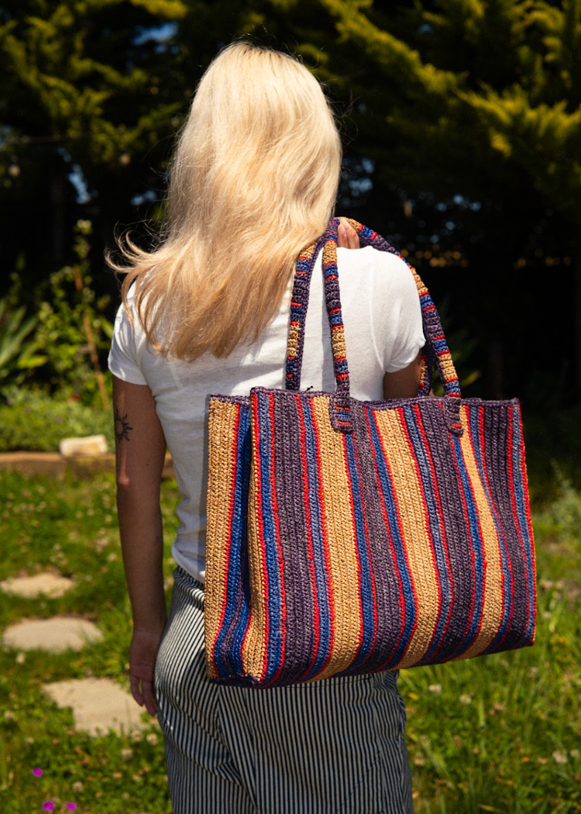 person wearing gabrielle frantzen Raffia Little Sister Bag in Denim Days