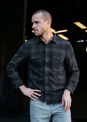 person wearing hiroshi kato mens The Brace Triple Twisted Plaid Shirt in Dark Forest