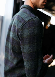 person wearing hiroshi kato mens The Brace Triple Twisted Plaid Shirt in Dark Forest