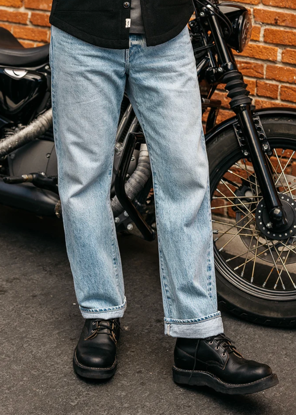 person wearing hiroshi kato mens The Pail Loose Straight 14.5oz Teacore Selvedge Jeans in Zoli Wash