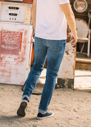 person wearing hiroshi kato mens The Pen Slim Straight Ace 10.5oz Stretch Selvedge Denim Jeans