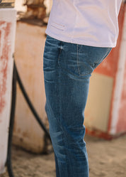 person wearing hiroshi kato mens The Pen Slim Straight Ace 10.5oz Stretch Selvedge Denim Jeans
