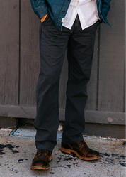 person wearing hiroshi kato mens The Pipe Straight Oxford Chino in Ash Black