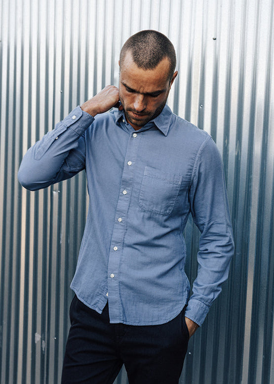 person wearing hiroshi kato mens The Ripper Double Gauze Shirt in Matte Blue
