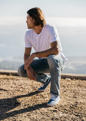 person wearing hiroshi kato mens The Stamp 9oz Organic Cotton Tee in Shell