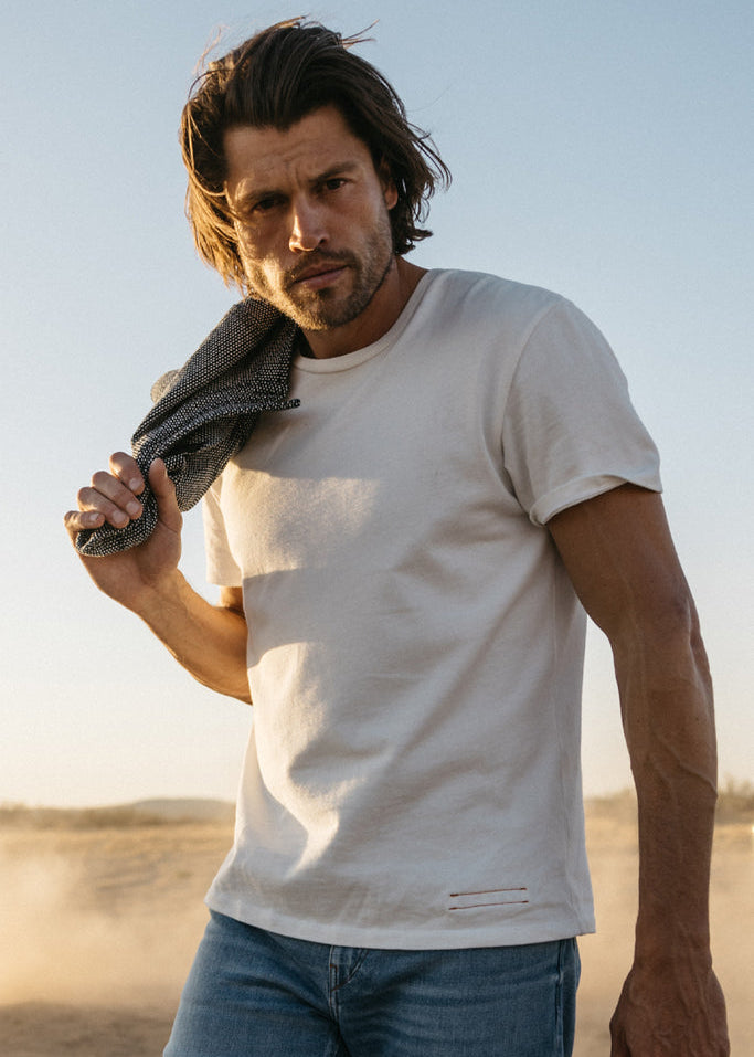 person wearing hiroshi kato mens The Stamp 9oz Organic Cotton Tee in Shell