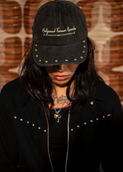 person wearing hollywood forever records unisex cotton stone washed Stoned & Studded Logo Hat