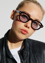 person wearing jimmy fairly unisex sunglasses The Napoli in Dark Tortoise