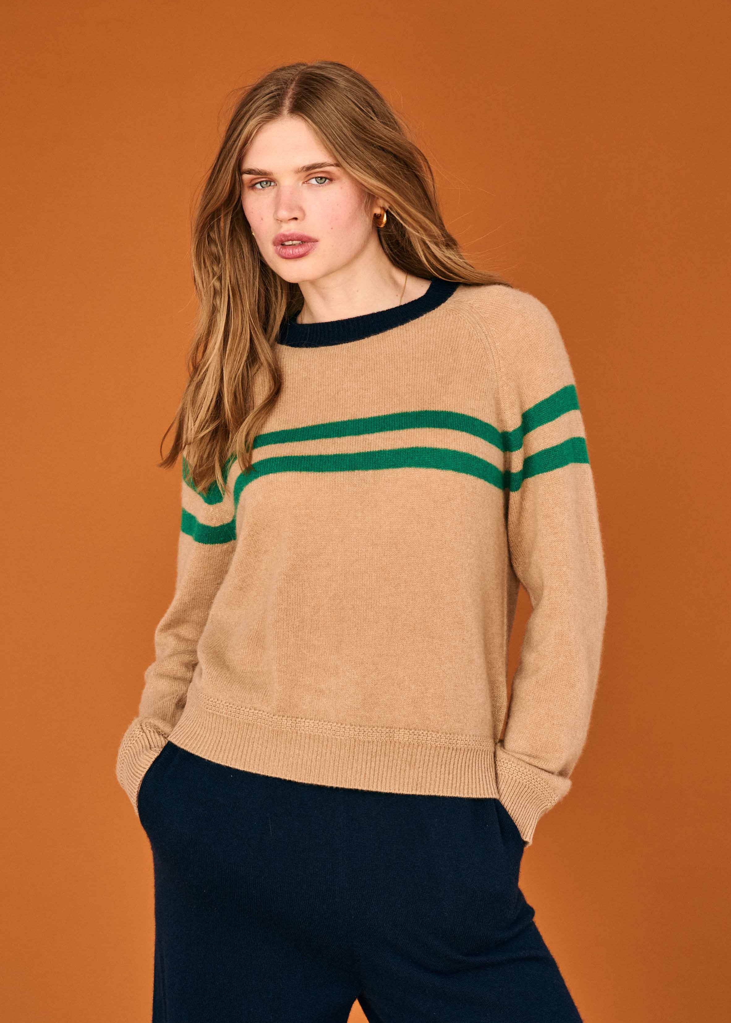 person wearing jumper1234 womens Cashmere Chest Stripe Crew Sweater sandstone navy green
