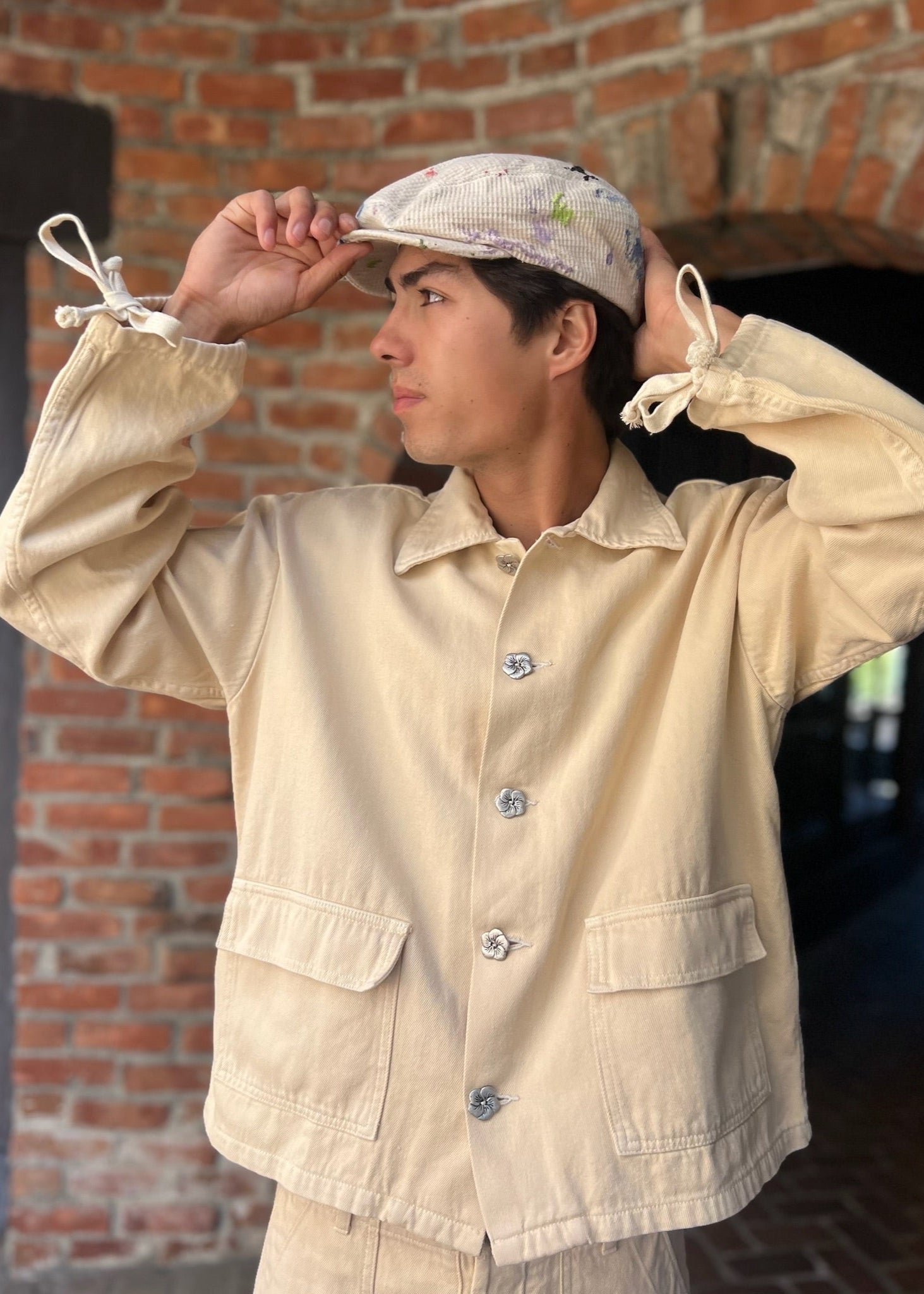 person wearing monostereo mens "Community of Lovers" Work Jacket in Cloud yellow