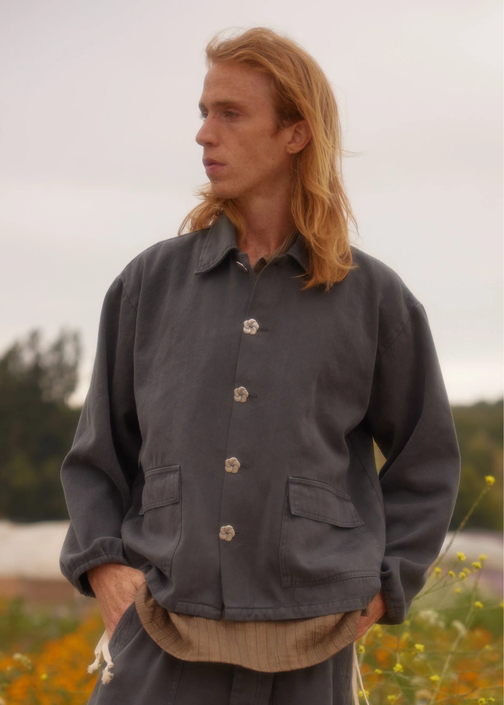 person wearing monostereo mens "Community of Lovers" Work Jacket in Washed Black and "Community of Lovers" Hemp Pants in Washed Black