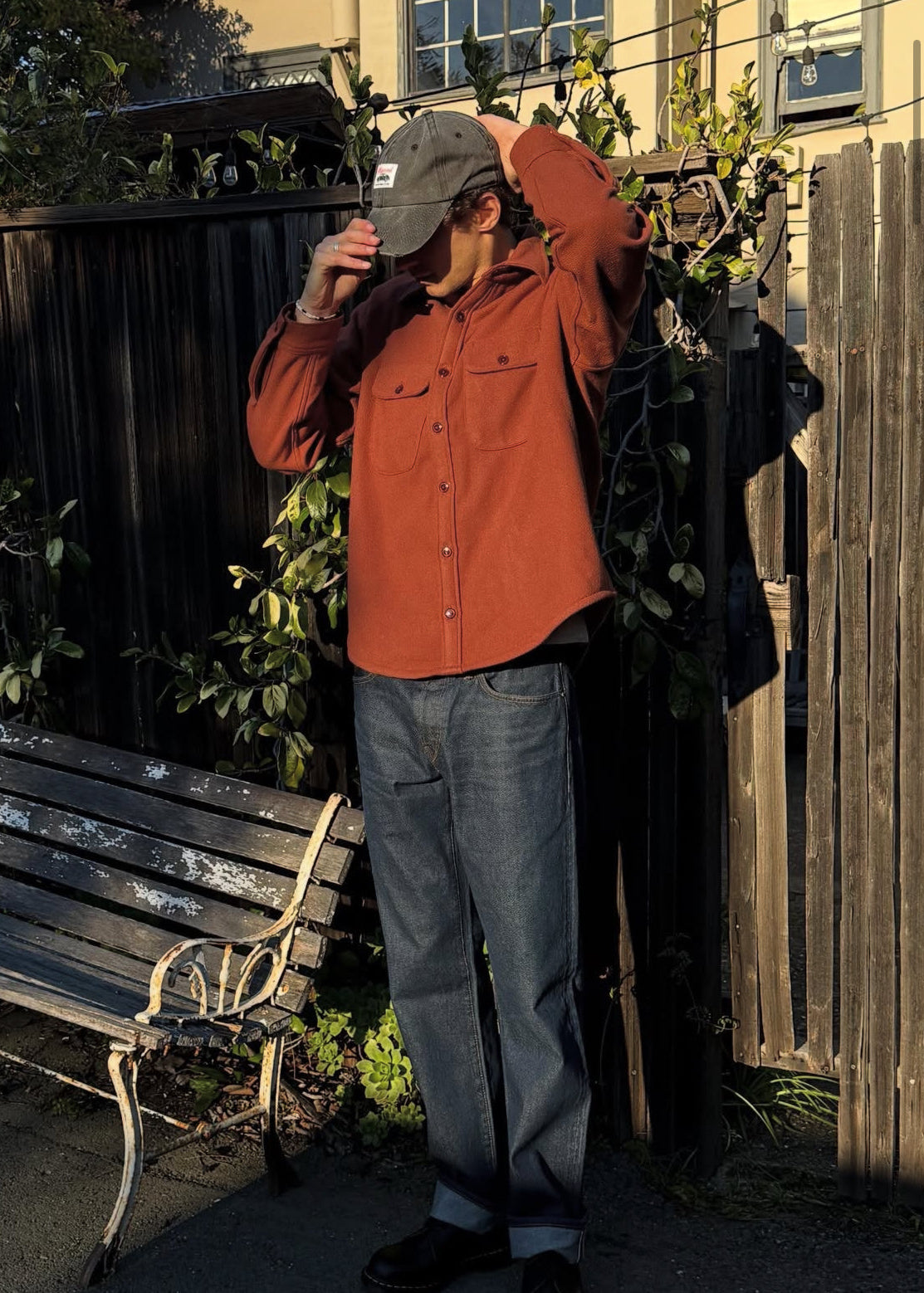 person wearing monostereo mens Wool Chamois Two Pocket Work Shirt in Red Earth rust