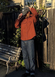 person wearing monostereo mens Wool Chamois Two Pocket Work Shirt in Red Earth rust