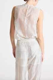 person wearing person wearing saint art womens Benson Floral Sequin Blouse and Sequin Hewes Pants in Ivory